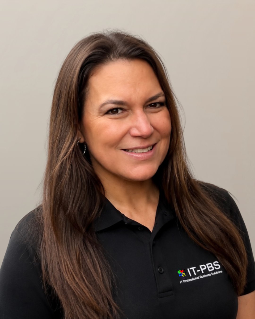 Jacqueline, Account Executive, smiling in black IT-PBS polo shirt